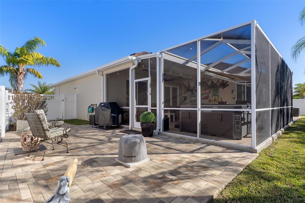 14617 Balloch Drive Hudson, FL 34667 - Photo 53 of 76 a view of a house with backyard sitting area and tub