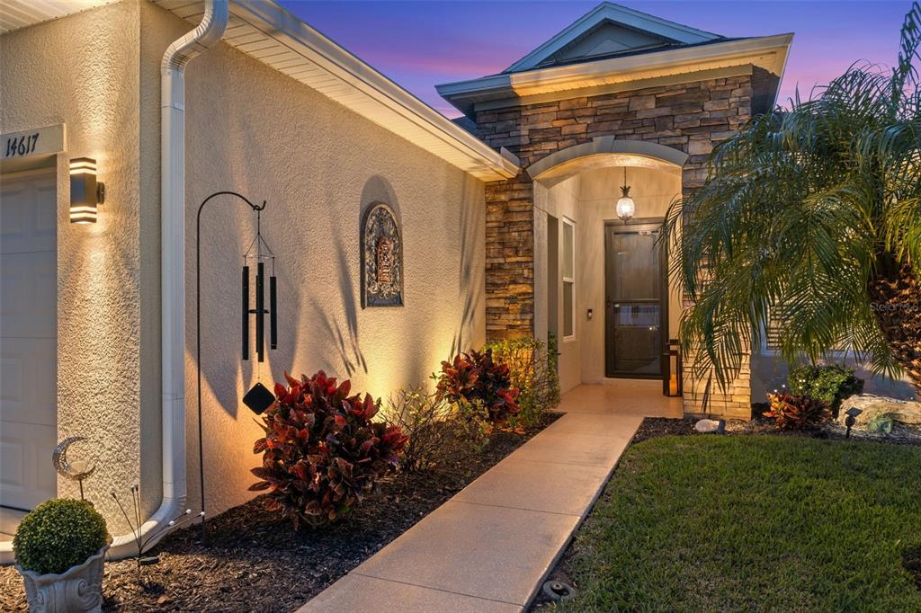 14617 Balloch Drive Hudson, FL 34667 - Photo 7 of 76 a front view of a house with a garden