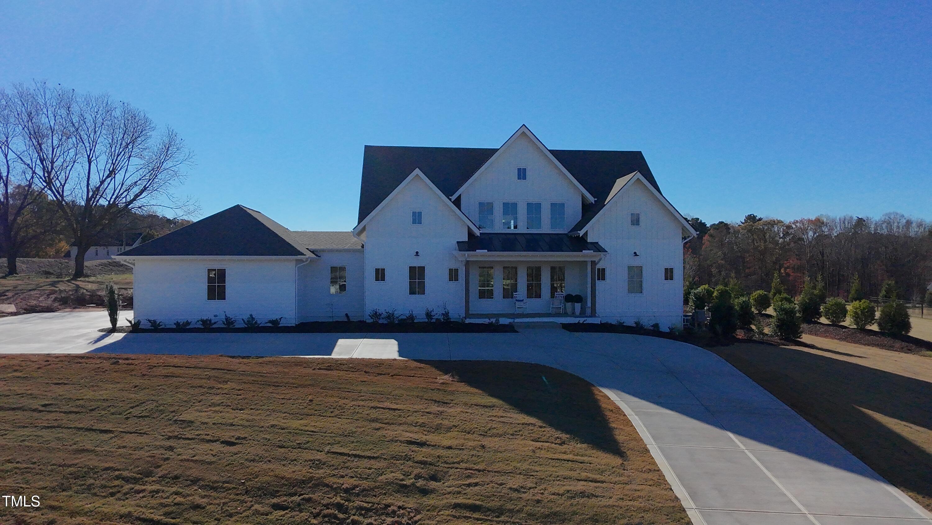 1632 Legacy Ridge Lane Wake Forest, NC 27587 - Photo 1 of 6 a front view of a house with a yard