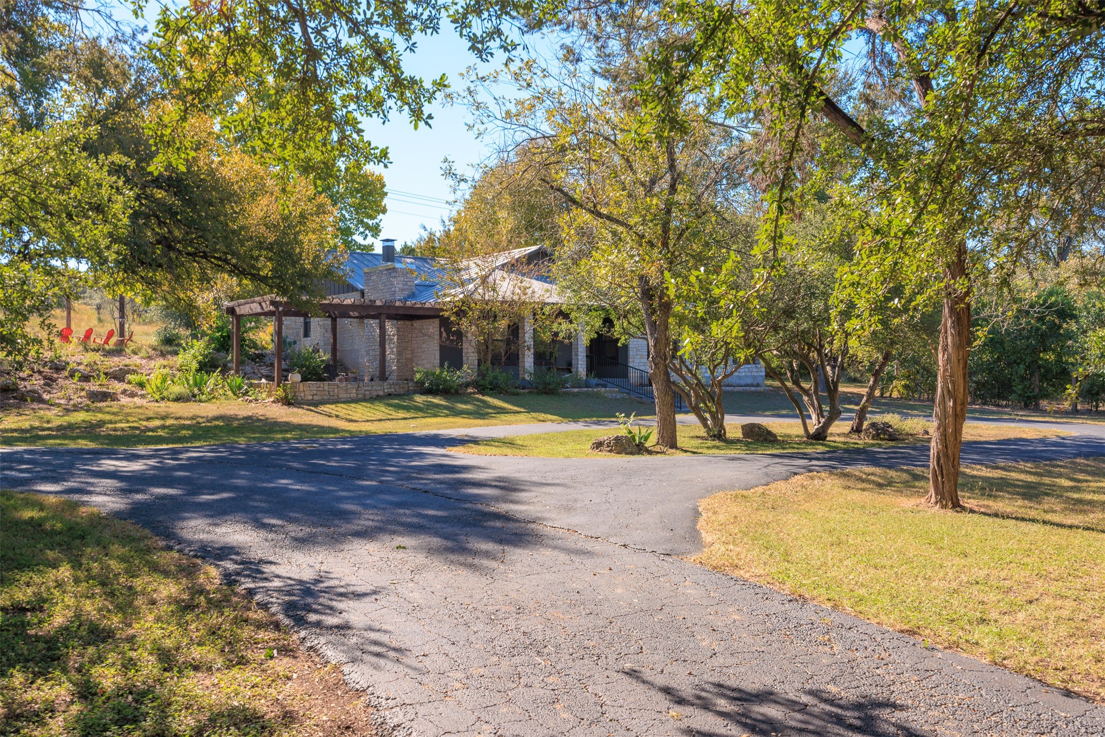 17100 Ranch Road 12 Wimberley, TX 78676 - Photo 1 of 1 Paved circular drive to home.