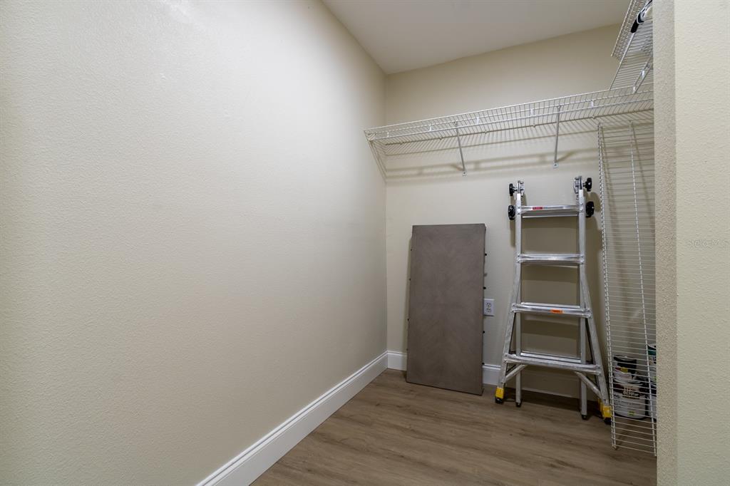 10000 Southwest 52nd Avenue, Unit 60 Gainesville, FL 32608 - Photo 16 of 36 a view of a room with wooden floor and closet