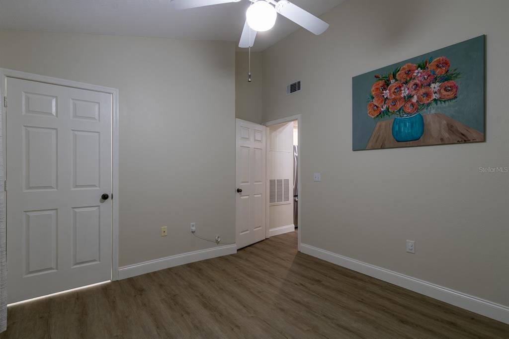 10000 Southwest 52nd Avenue, Unit 60 Gainesville, FL 32608 - Photo 19 of 36 a view of an empty room with wooden floor