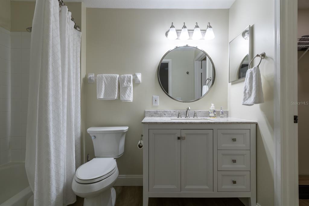 10000 Southwest 52nd Avenue, Unit 60 Gainesville, FL 32608 - Photo 20 of 36 a bathroom with a toilet a sink and mirror