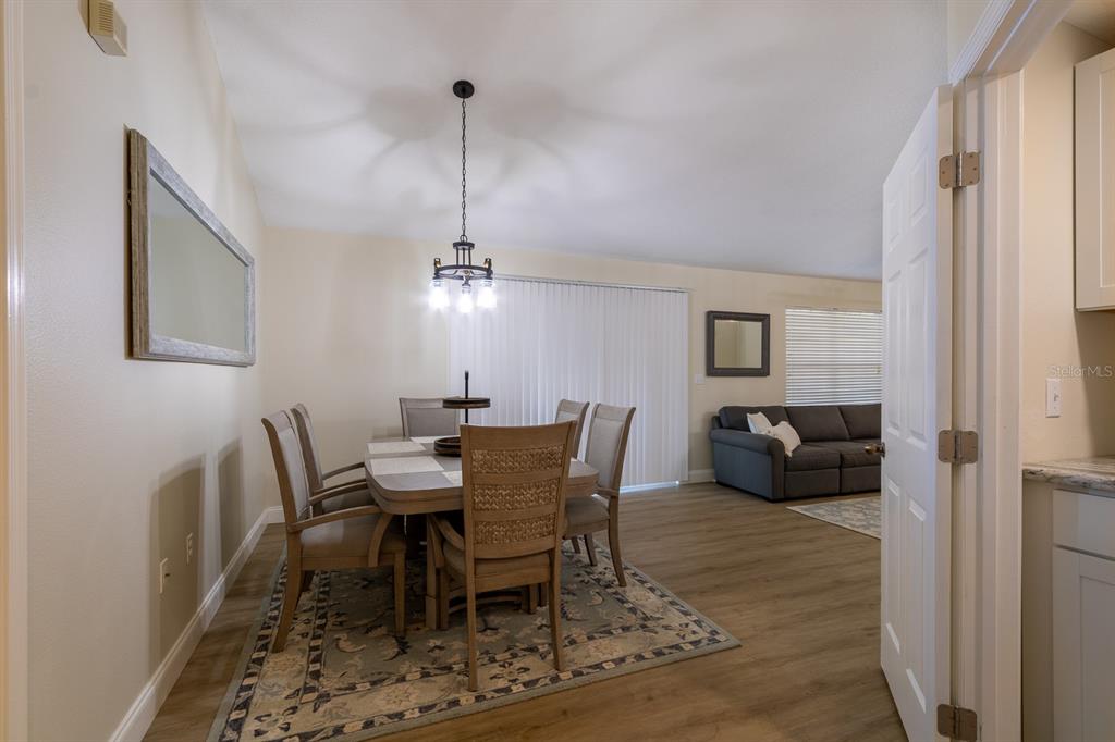 10000 Southwest 52nd Avenue, Unit 60 Gainesville, FL 32608 - Photo 7 of 36 a view of a dining room with furniture