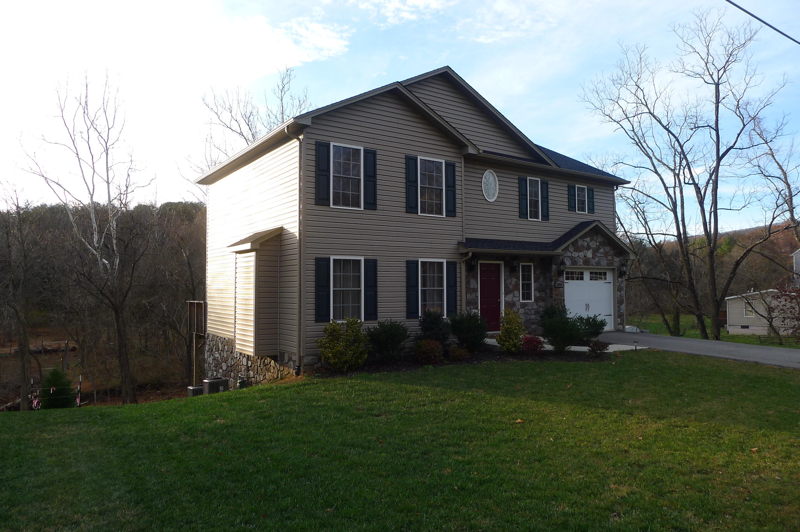 2850 Green Ridge Road Northwest Roanoke, VA 24019 - Photo 2 of 30 a front view of a house with garden and trees