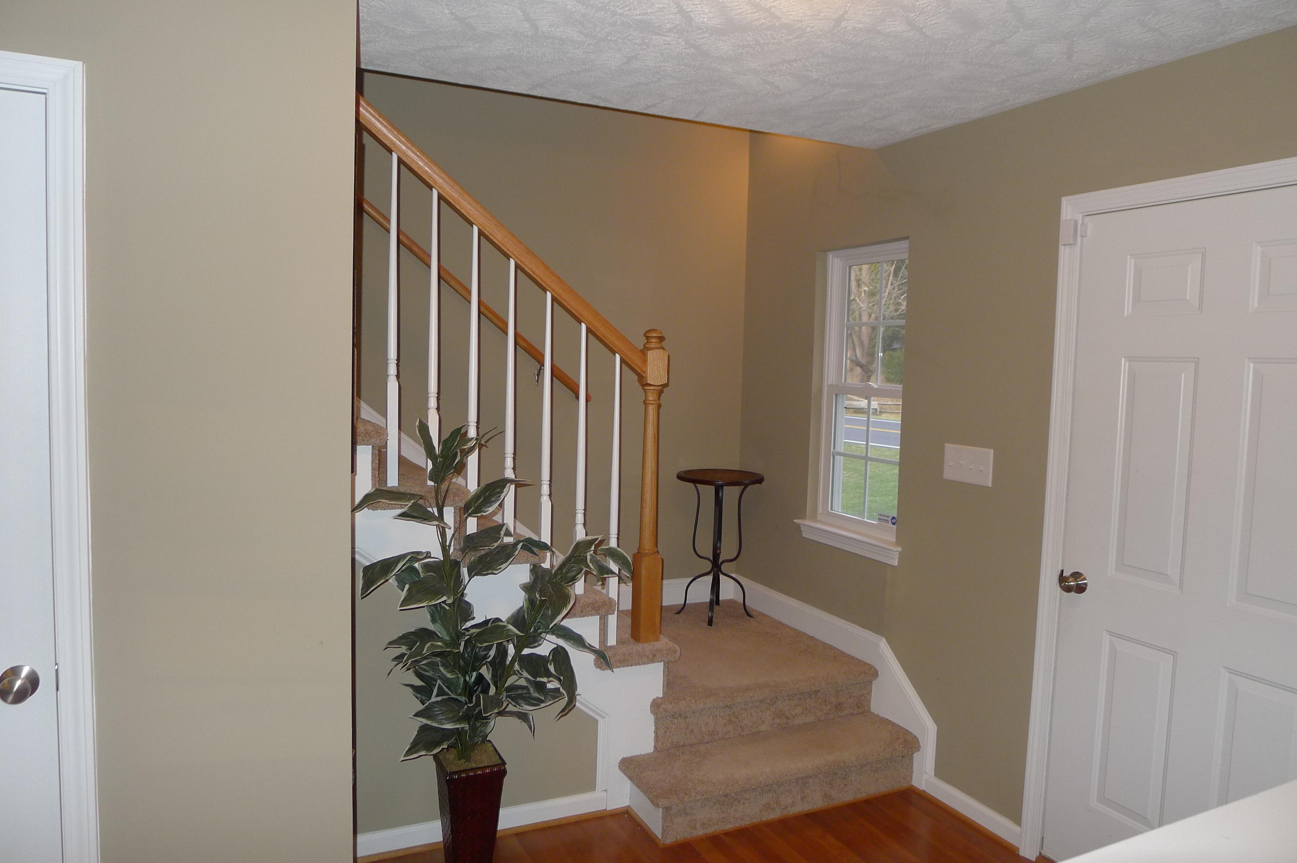 2850 Green Ridge Road Northwest Roanoke, VA 24019 - Photo 17 of 30 a view of a hallway with wooden floor windows and a livingroom
