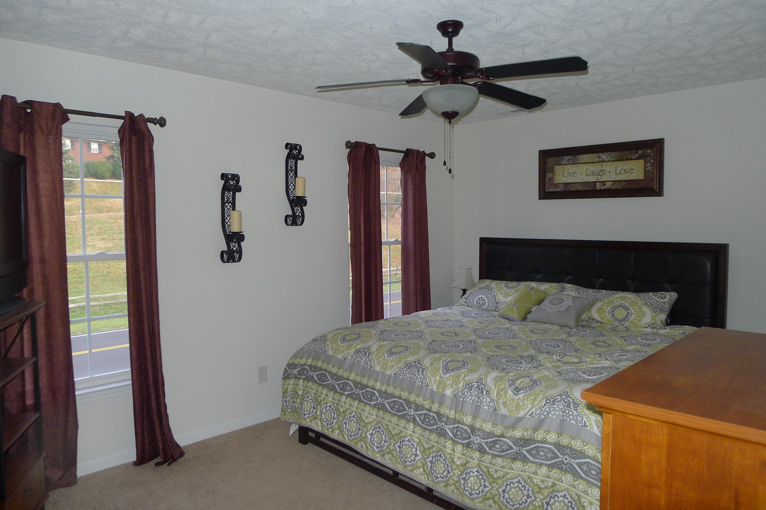 2850 Green Ridge Road Northwest Roanoke, VA 24019 - Photo 21 of 30 a bedroom with a bed and a chandelier