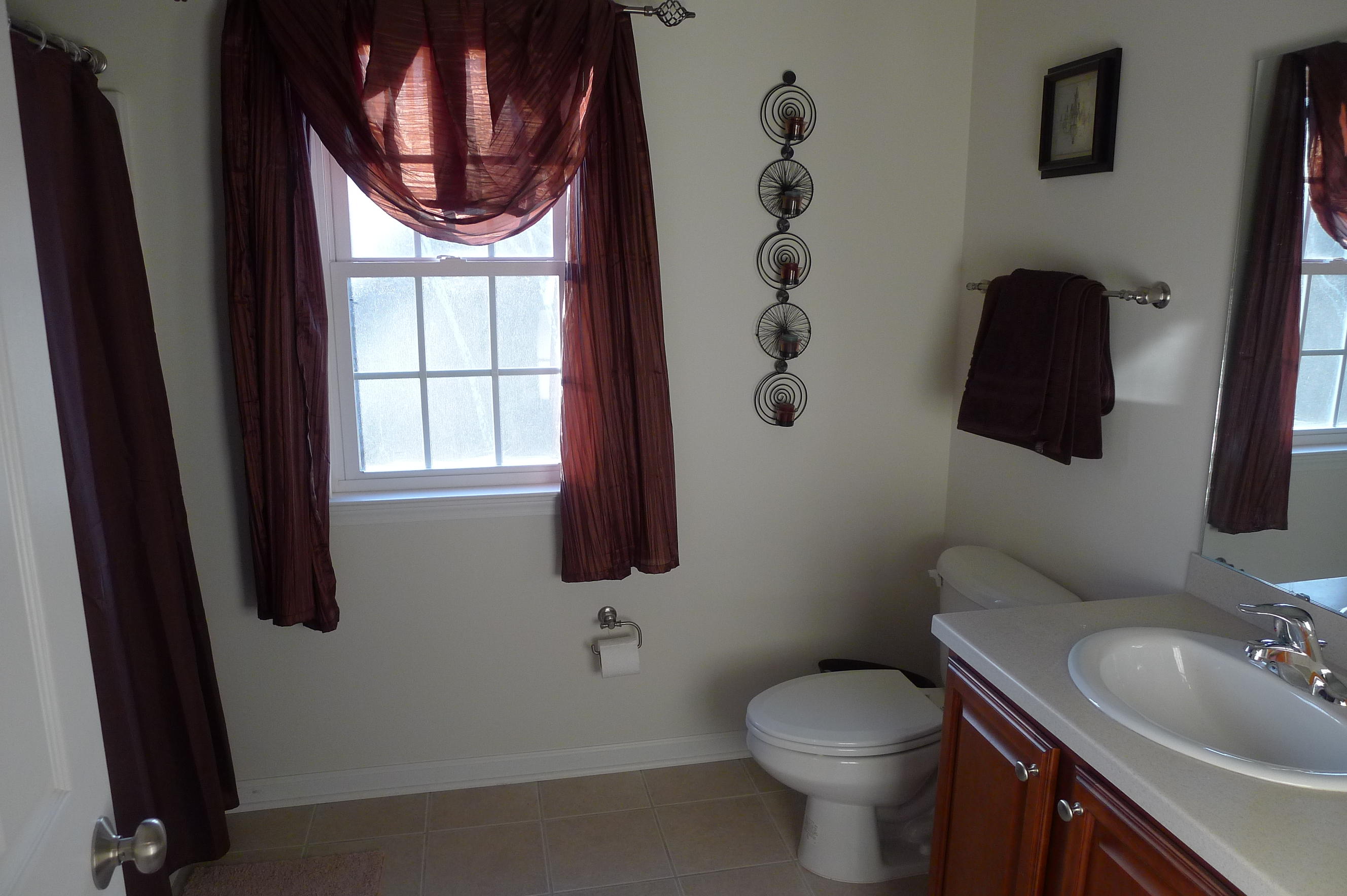 2850 Green Ridge Road Northwest Roanoke, VA 24019 - Photo 26 of 30 a bathroom with a toilet sink and mirror