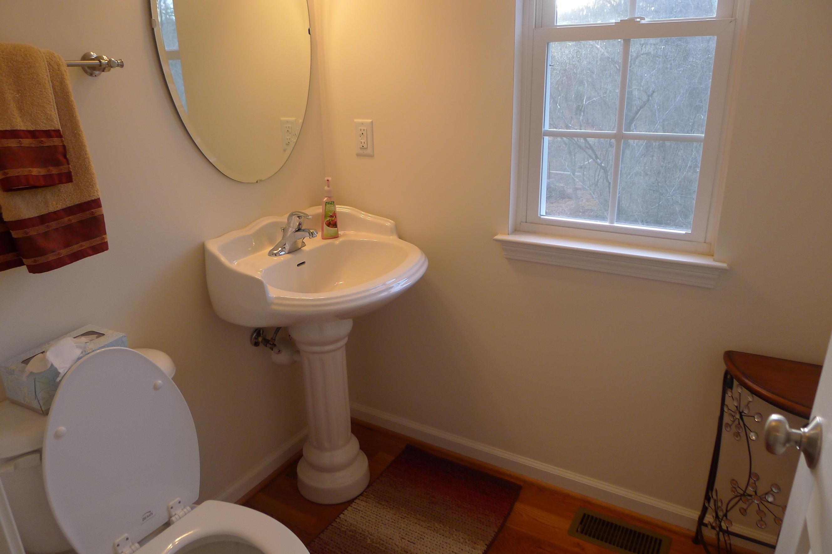 2850 Green Ridge Road Northwest Roanoke, VA 24019 - Photo 10 of 30 a bathroom with a sink mirror and toilet