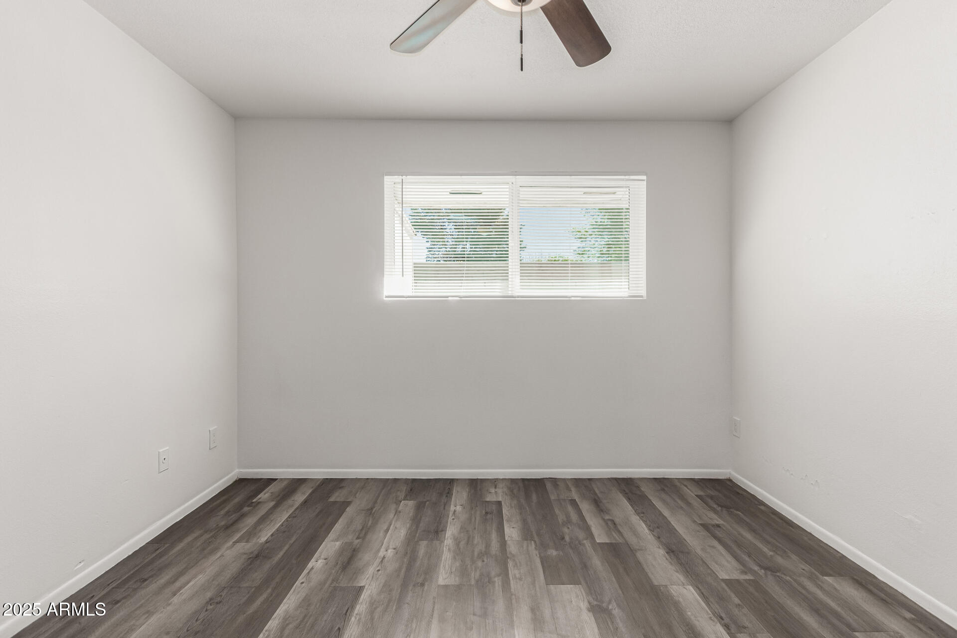 131 North Horne, Unit E Mesa, AZ 85203 - Photo 14 of 26 an empty room with a window