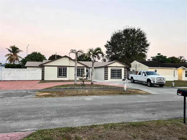 a view of a house with a street