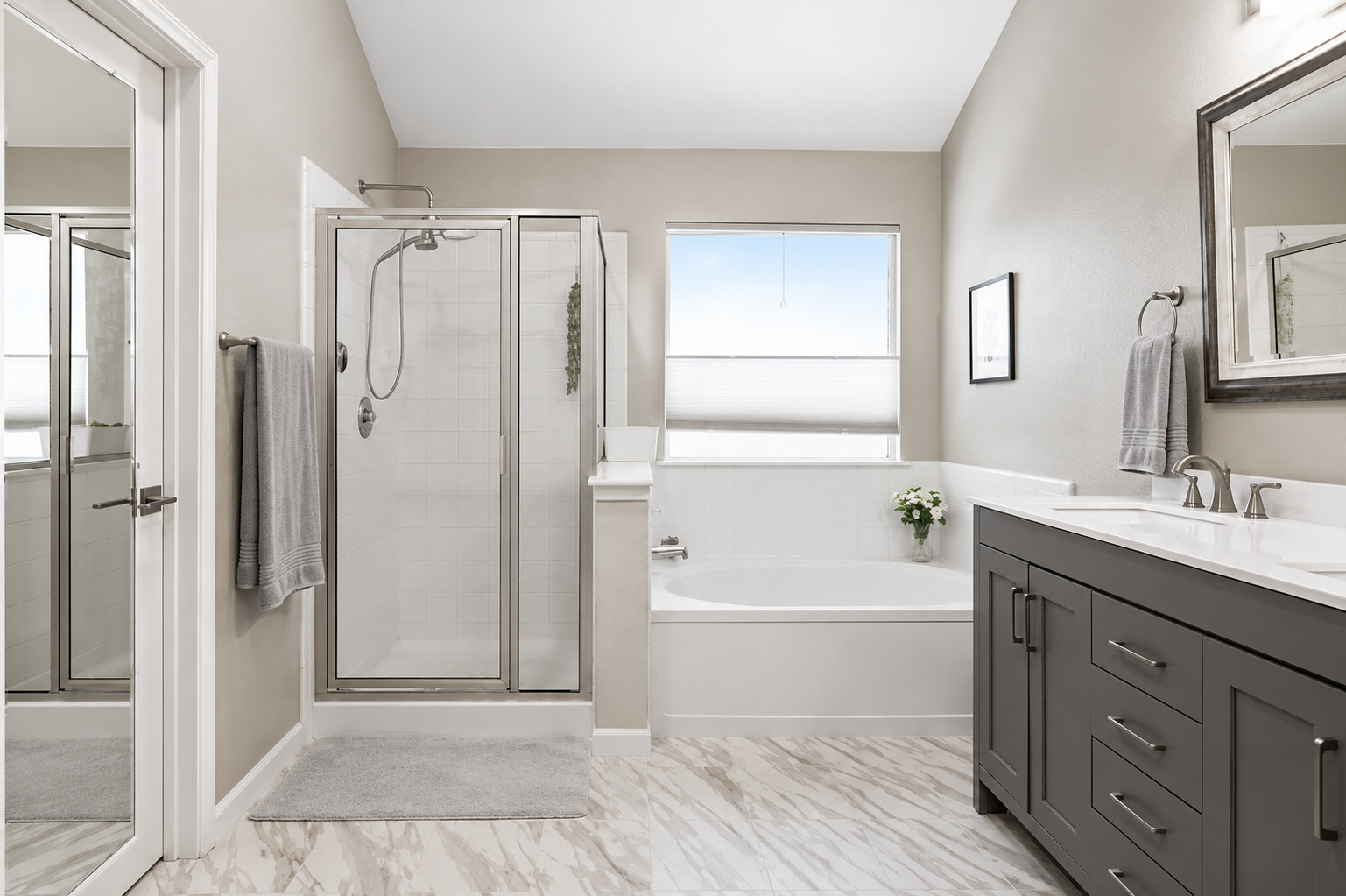 1921 Rutherford Drive Leander, TX 78641 - Photo 19 of 29 High vaulted ceilings and sleek tile flooring elevate this bathroom featuring a separate soaking tub.