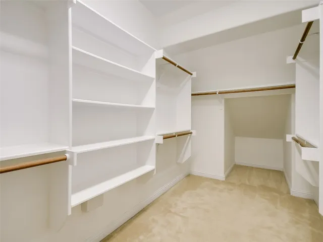 a view of an empty walk in closet