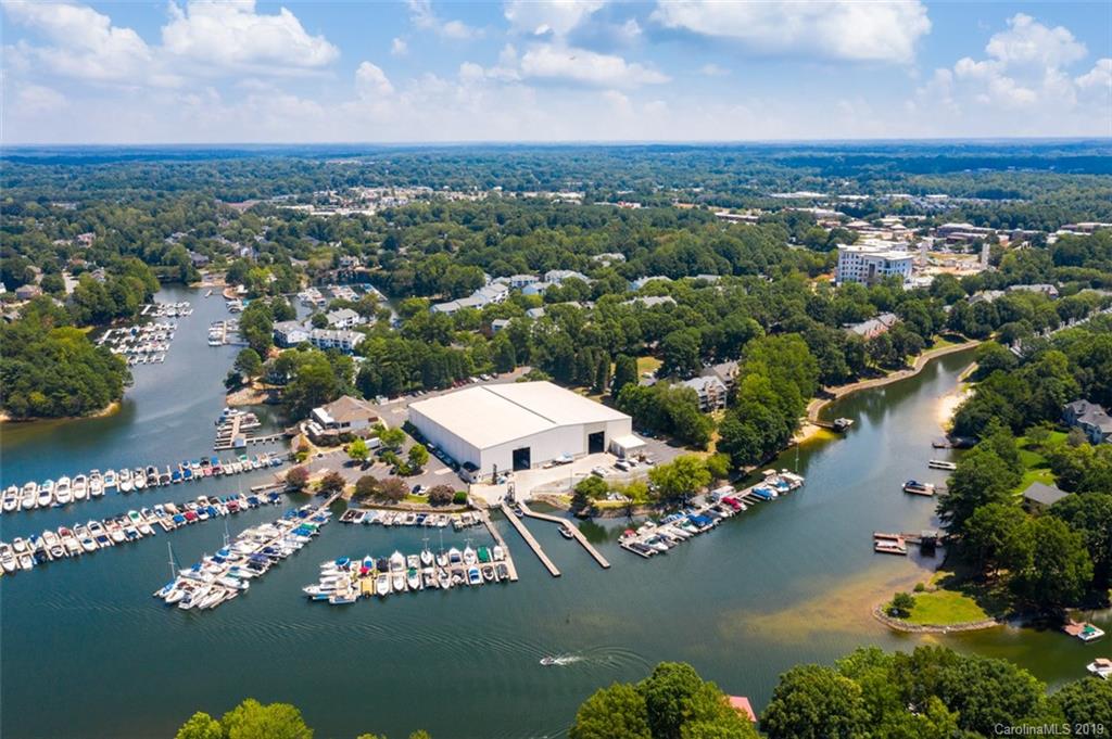 an aerial view of a house with a lake view