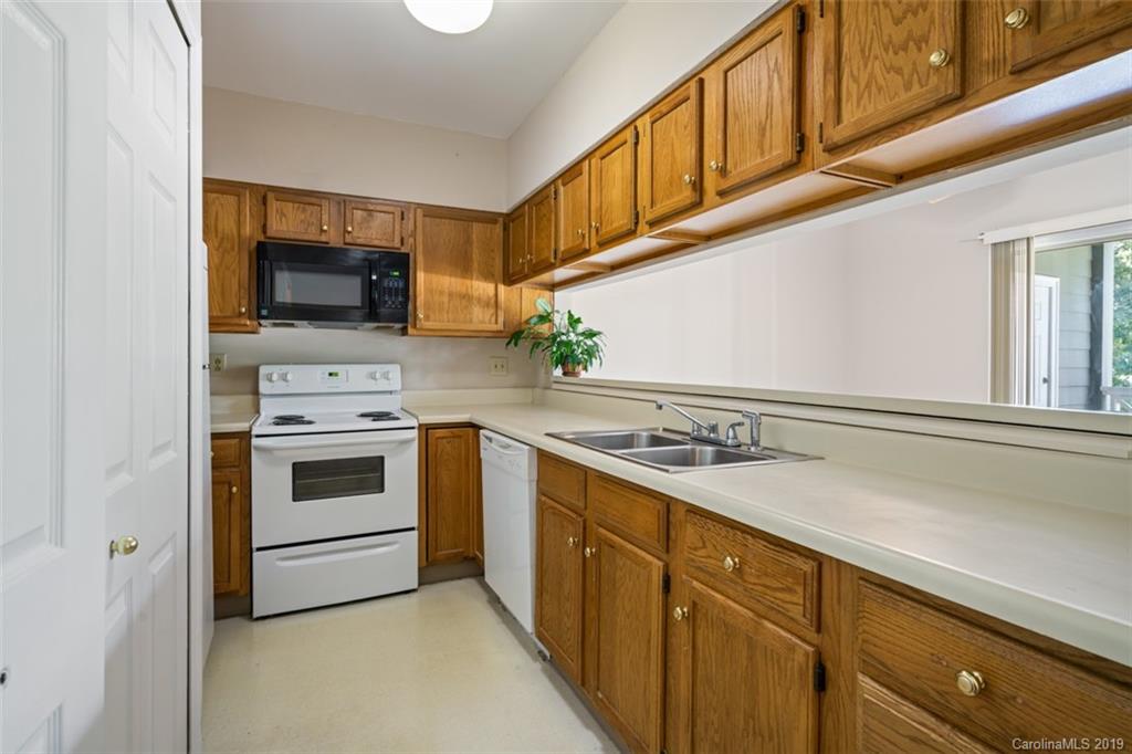 20109 Henderson Road, Unit A Cornelius, NC 28031 - Photo 15 of 25 a kitchen with a stove and a microwave