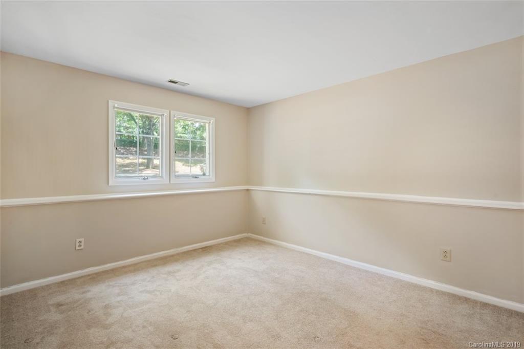 20109 Henderson Road, Unit A Cornelius, NC 28031 - Photo 16 of 25 an empty room with a window