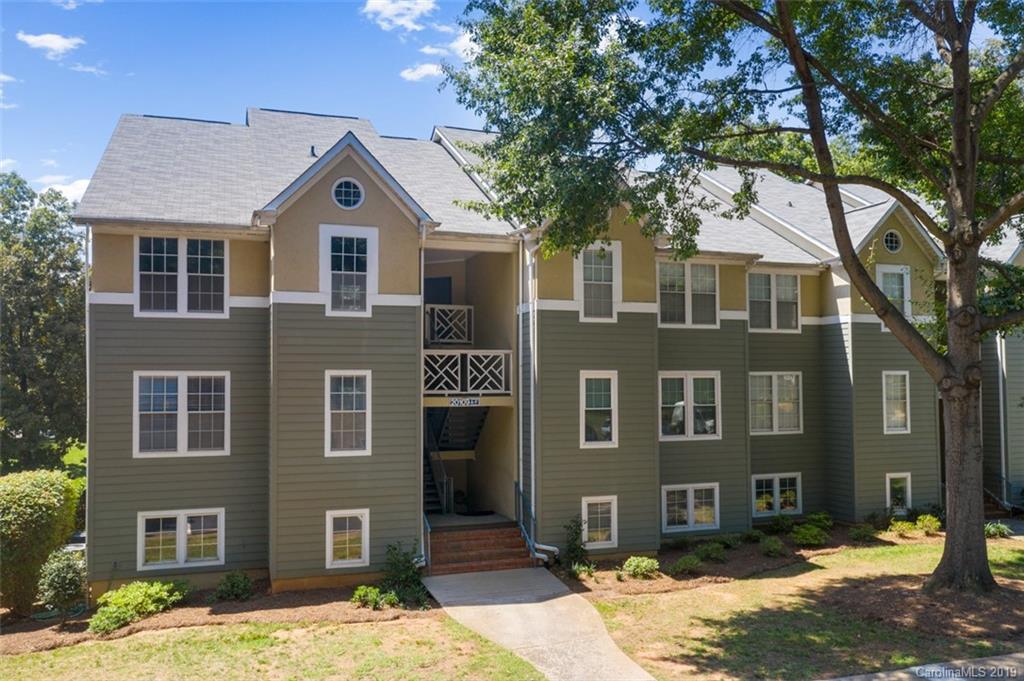 20109 Henderson Road, Unit A Cornelius, NC 28031 - Photo 6 of 25 a front view of a house with a yard