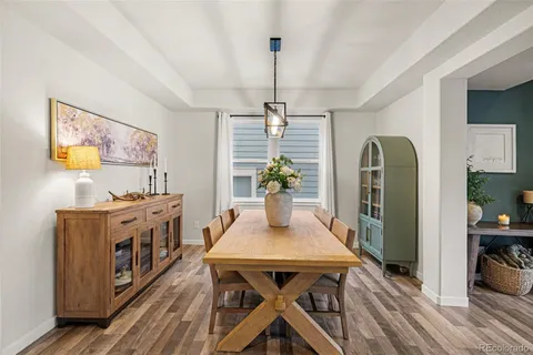 a view of a dining room with furniture window and wooden floor