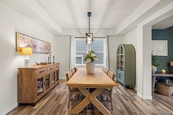 a view of a dining room with furniture window and wooden floor