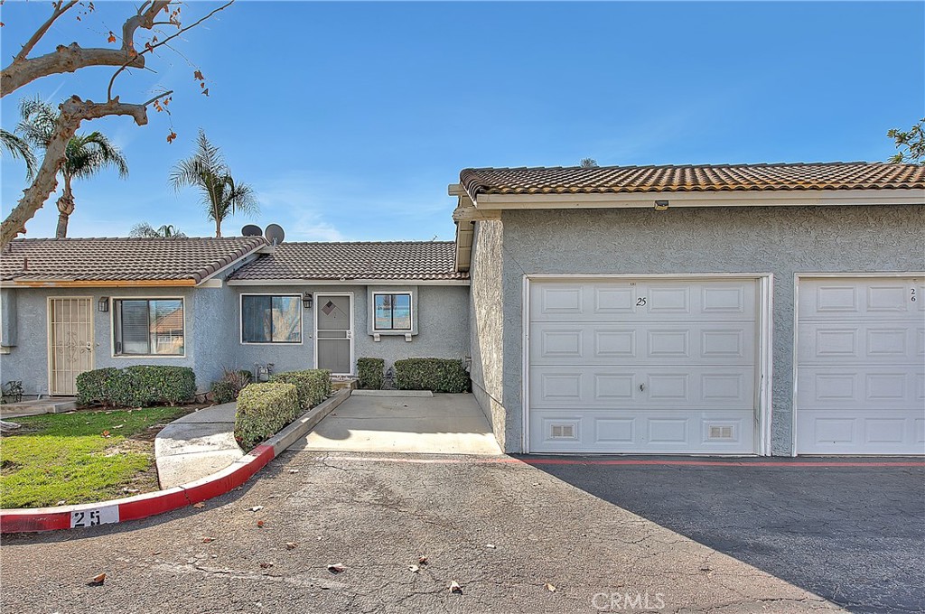 9505 Arlington Avenue, Unit 25 Riverside, CA 92503 - Photo 1 of 1 front view of a house with a yard