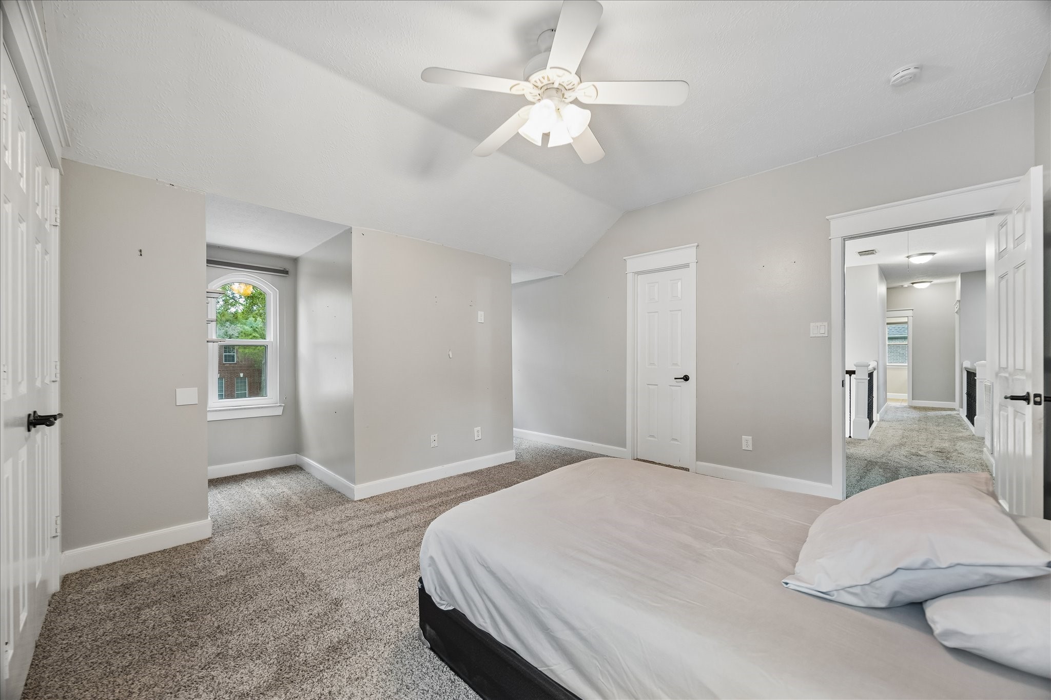 23039 Enchanted Landing Lane Katy, TX 77494 - Photo 24 of 30 a bedroom with a bed chandelier and a window