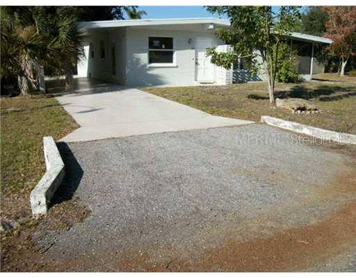 270 Zephyr Road Venice, FL 34293 - Photo 1 of 1 a front view of a house with a yard and garage