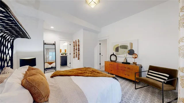 a bed room with a bed and a couch