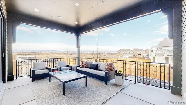 a balcony with furniture and city view