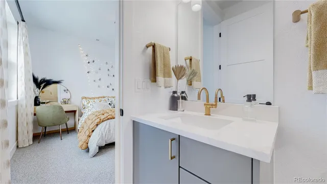 a en suite bathroom with a sink and mirror