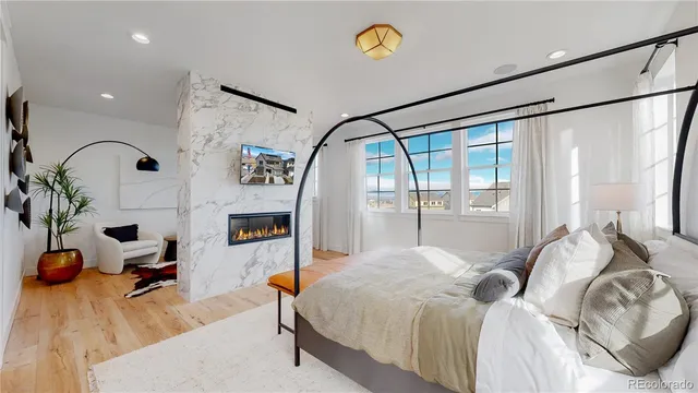 a bedroom with a bed window and table