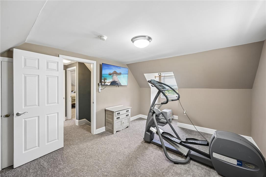 4065 Airport Road Allentown, PA 18109 - Photo 16 of 28 A well-lit exercise room, featuring soft carpeting, offers ample space for fitness equipment.
