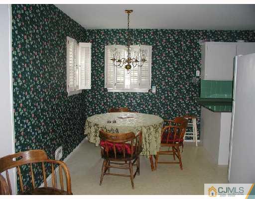 188 North Hill Road Colonia, NJ 07067 - Photo 3 of 10 a dining room with furniture and a chandelier