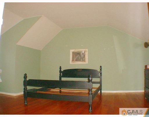 188 North Hill Road Colonia, NJ 07067 - Photo 8 of 10 a view of a room with furniture and a wooden floor
