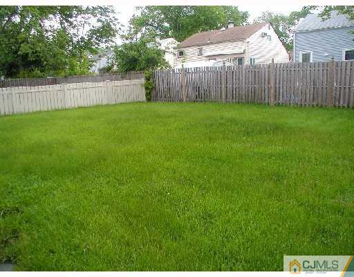 188 North Hill Road Colonia, NJ 07067 - Photo 9 of 10 a view of a backyard with a wooden fence