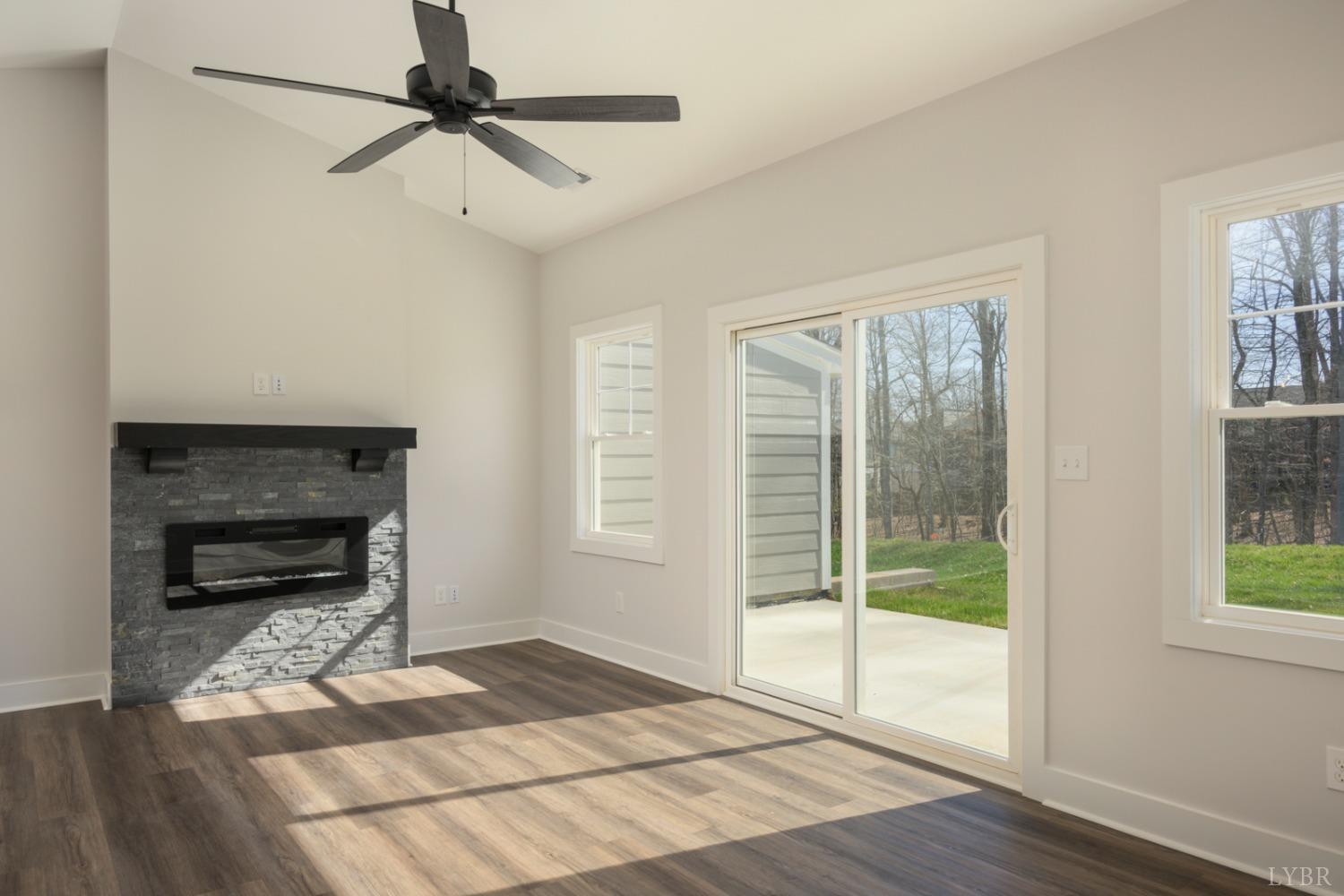 125 Lockridge Lane Lynchburg, VA 24502 - Photo 11 of 28 a living room with wooden floor and a fireplace
