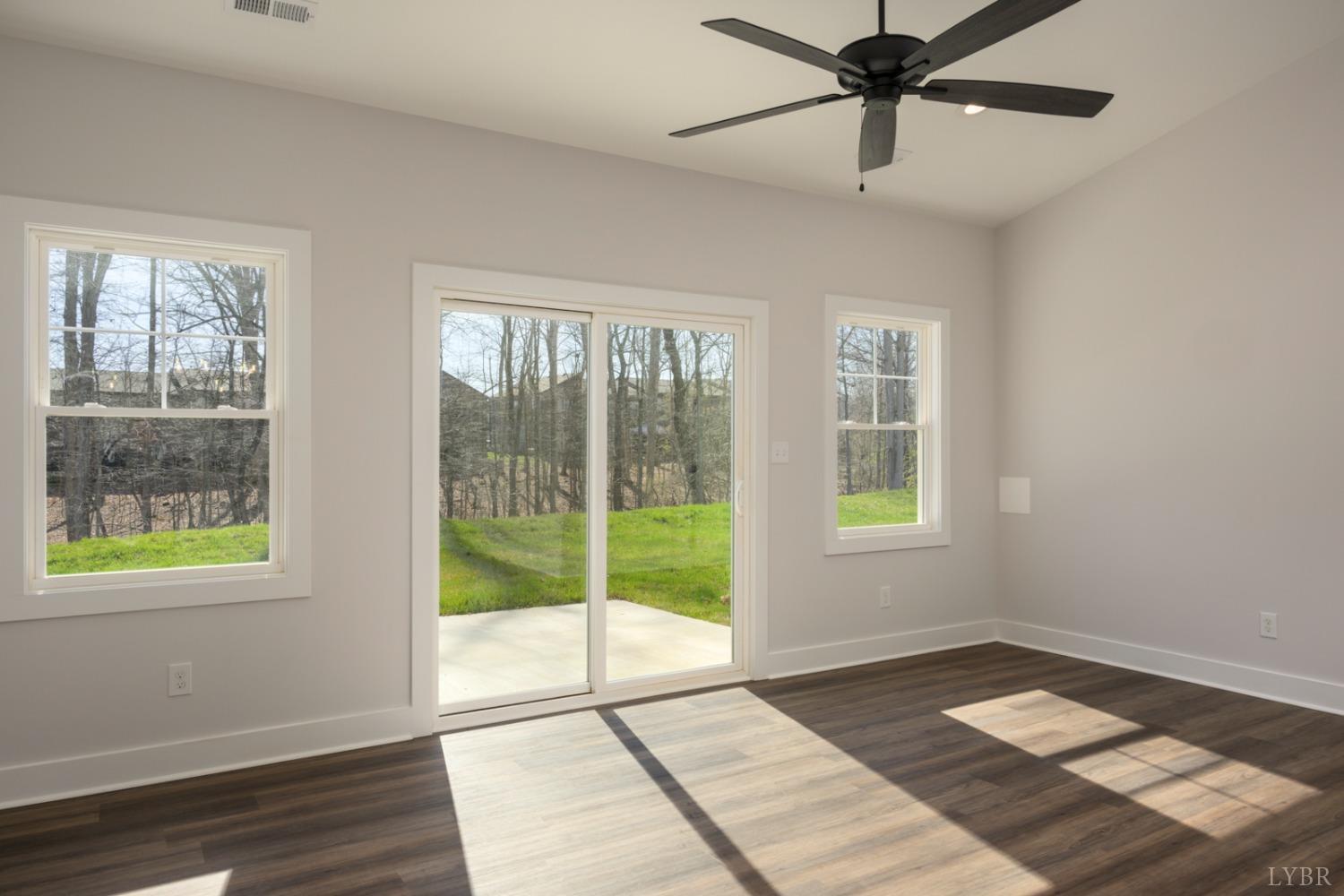 125 Lockridge Lane Lynchburg, VA 24502 - Photo 12 of 28 a view of an empty room with a window and wooden floor