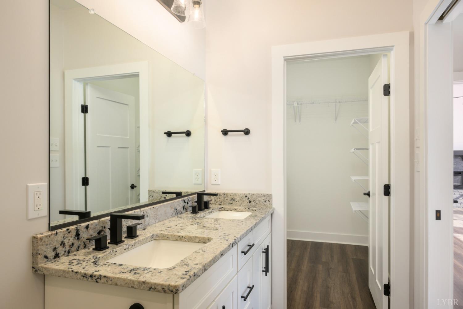 125 Lockridge Lane Lynchburg, VA 24502 - Photo 16 of 28 a bathroom with a granite countertop sink and a mirror