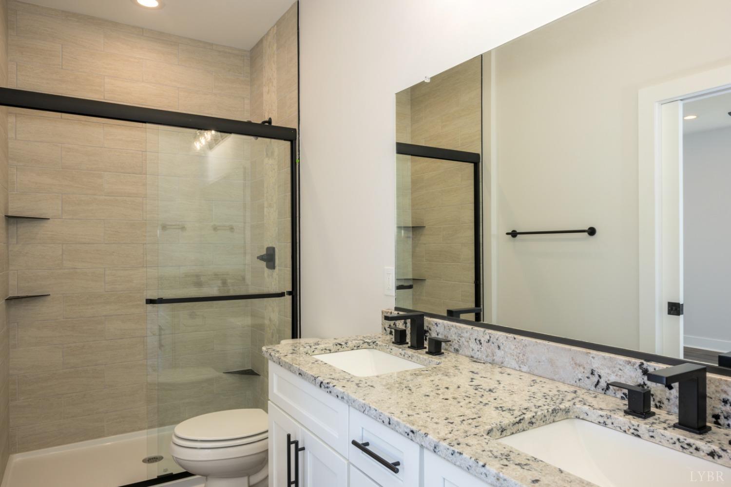 125 Lockridge Lane Lynchburg, VA 24502 - Photo 18 of 28 a bathroom with a granite countertop sink toilet and shower