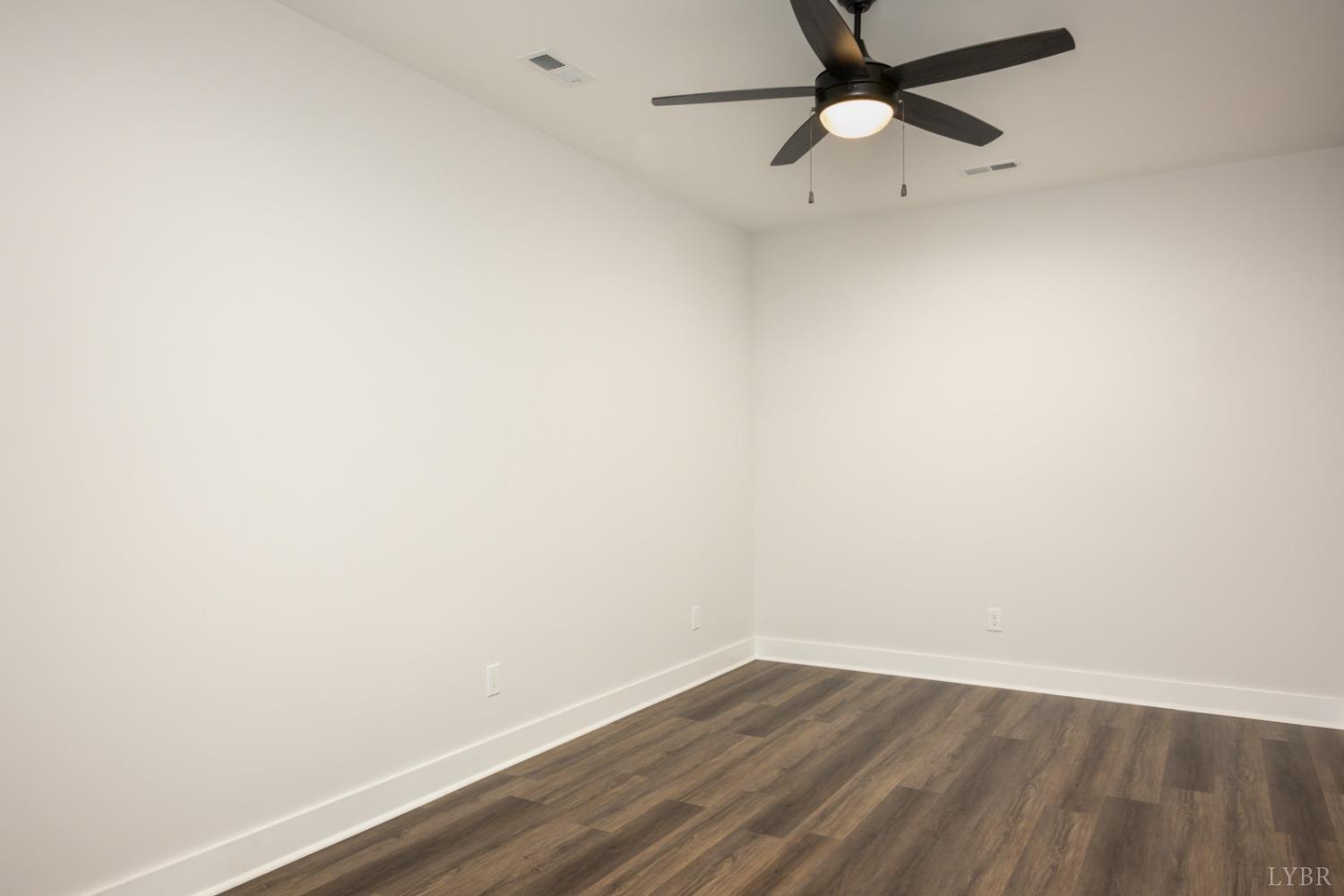 125 Lockridge Lane Lynchburg, VA 24502 - Photo 26 of 28 a view of an empty room with wooden floor