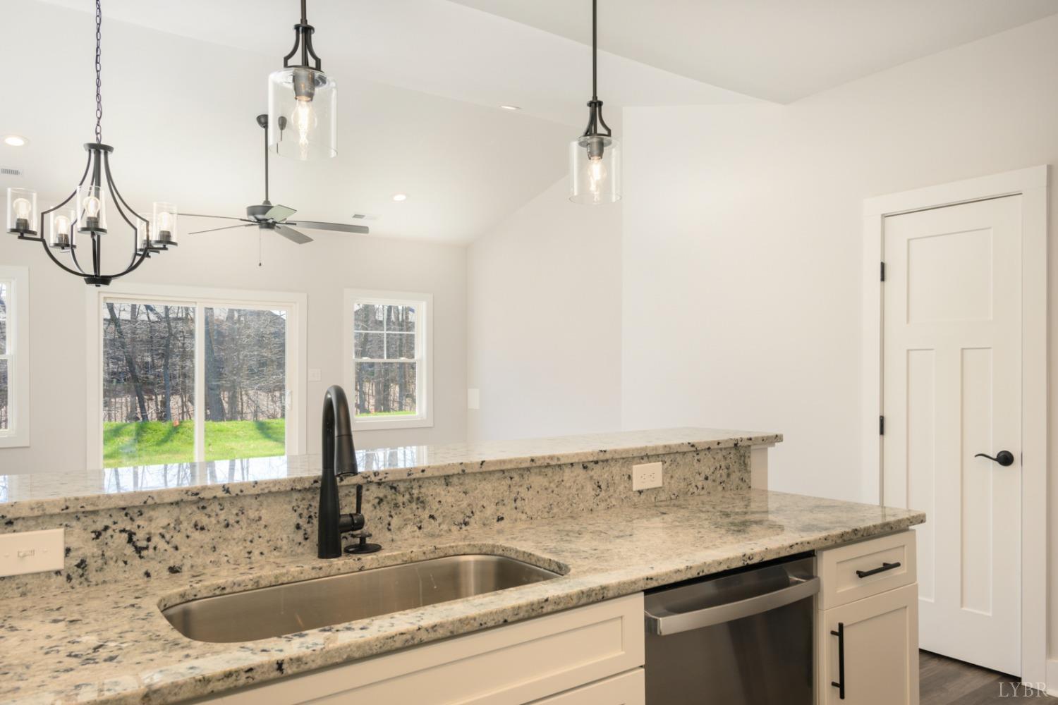 125 Lockridge Lane Lynchburg, VA 24502 - Photo 7 of 28 a kitchen with a sink a chandelier and glass door