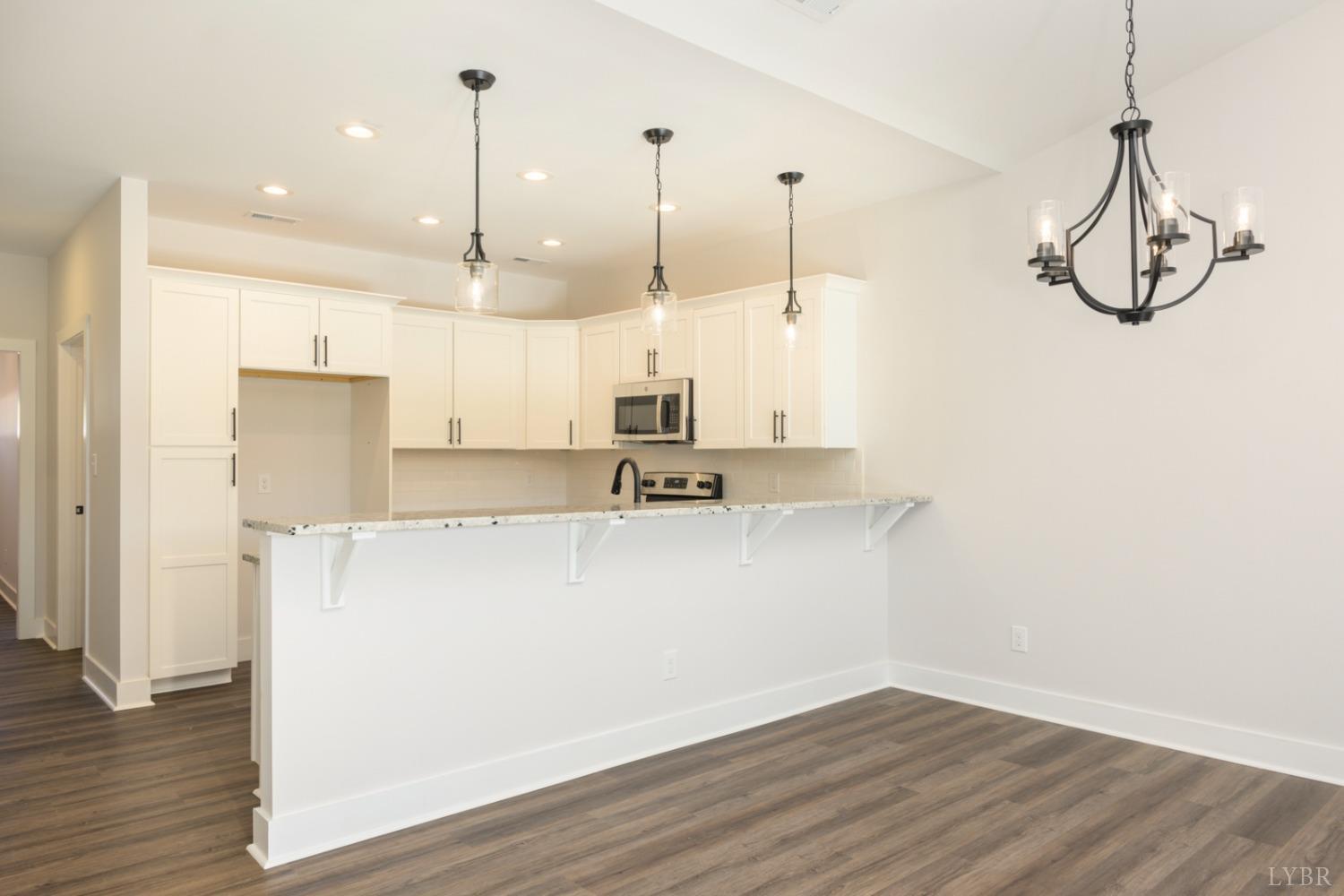 125 Lockridge Lane Lynchburg, VA 24502 - Photo 8 of 28 a view of a kitchen with stainless steel appliances granite countertop cabinets and wooden floor