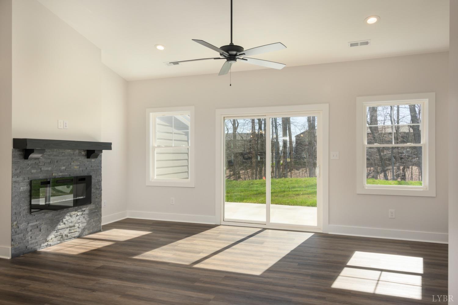 125 Lockridge Lane Lynchburg, VA 24502 - Photo 9 of 28 a view of an empty room with a window and fireplace