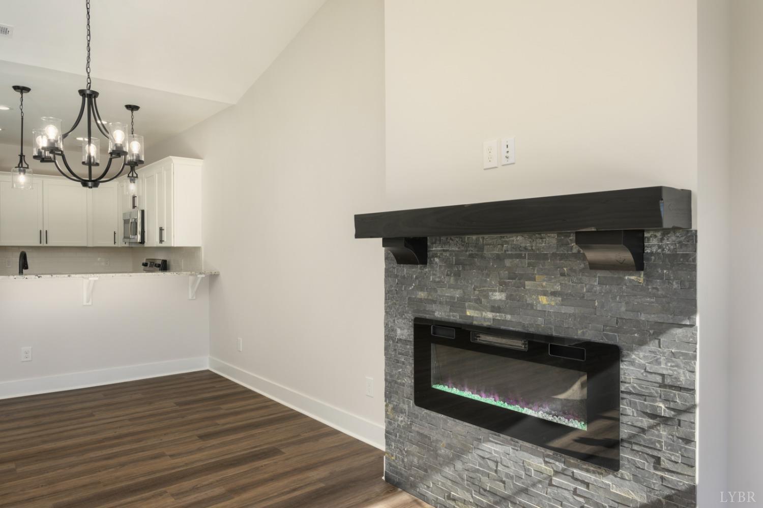 125 Lockridge Lane Lynchburg, VA 24502 - Photo 10 of 28 a room with a fireplace and wooden floor