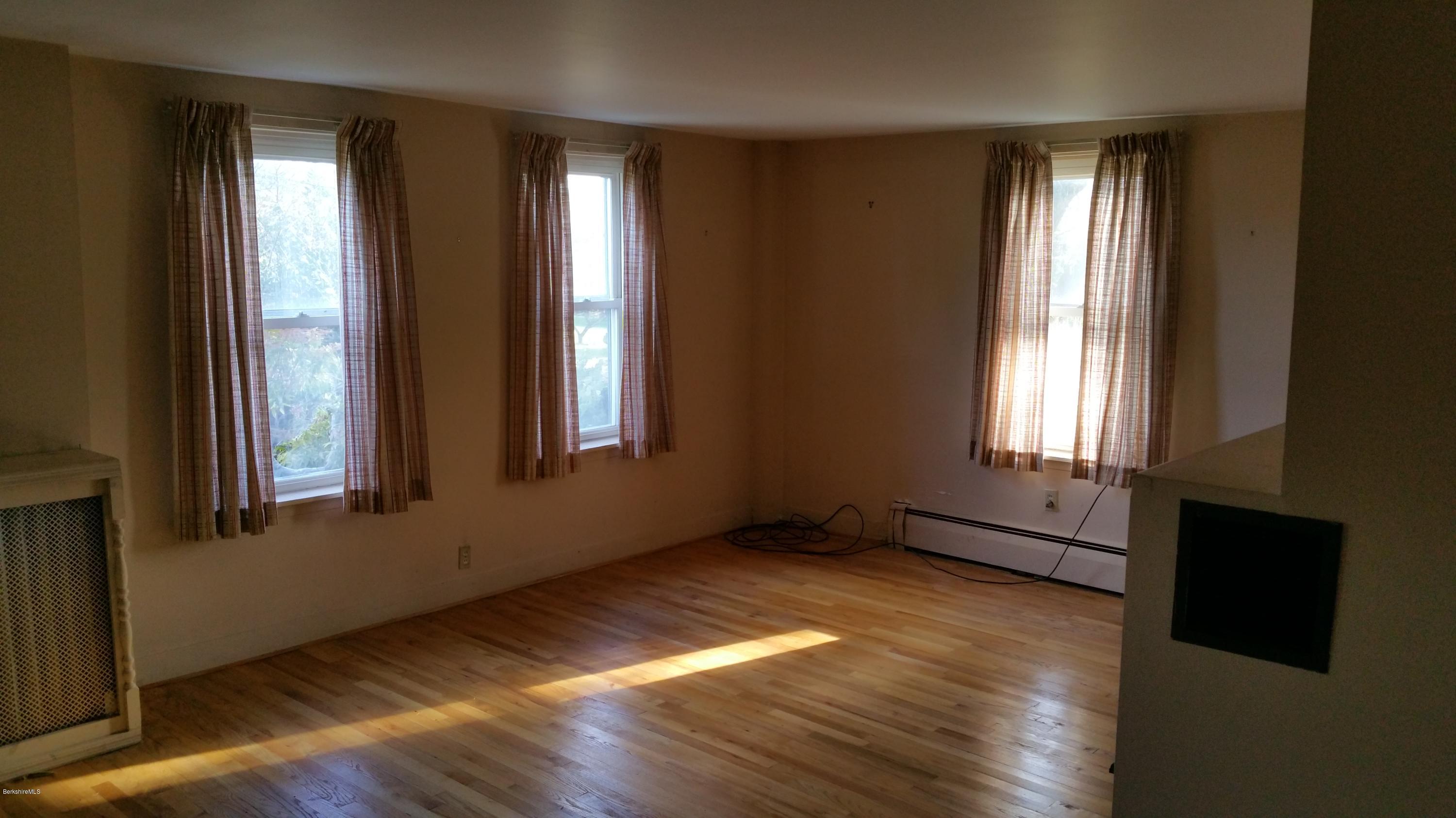198 State Road Richmond, MA 01201 - Photo 14 of 27 an empty room with wooden floor and windows