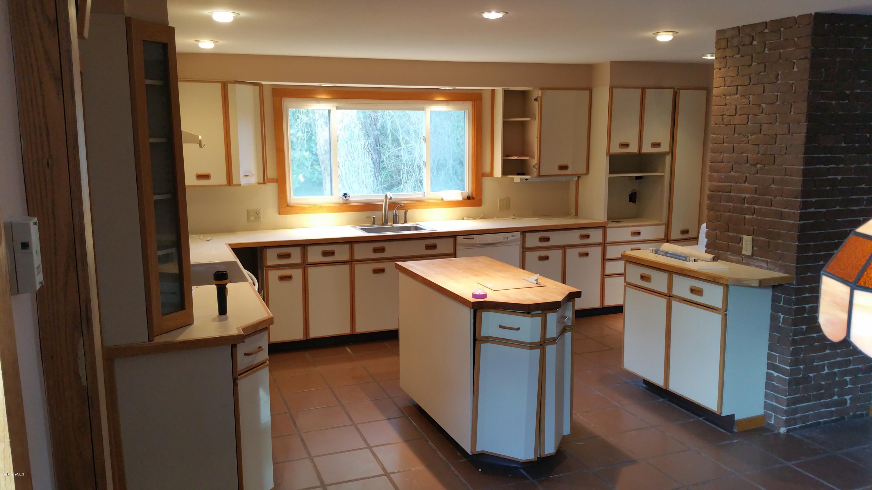 198 State Road Richmond, MA 01201 - Photo 9 of 27 a kitchen with a sink stove and cabinets