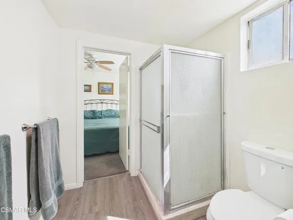 a bathroom with a shower and a toilet