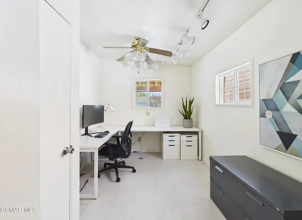a view of a workspace with furniture
