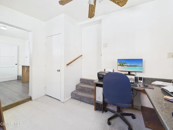 a workspace with furniture and lamp