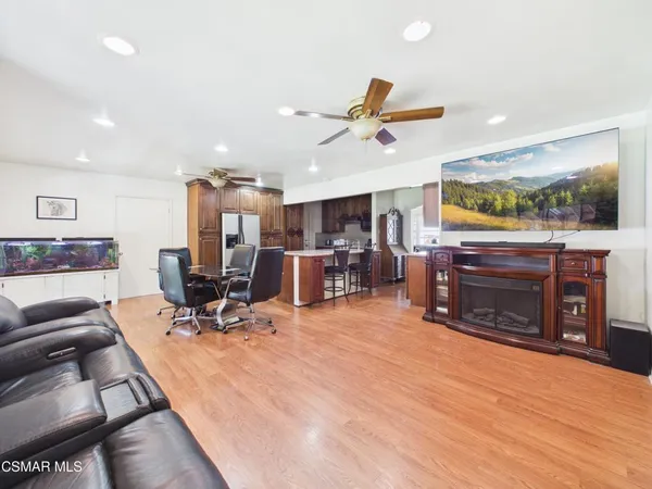 a view of a room with furniture and a fireplace