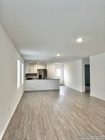 a view of a kitchen with a sink and a window